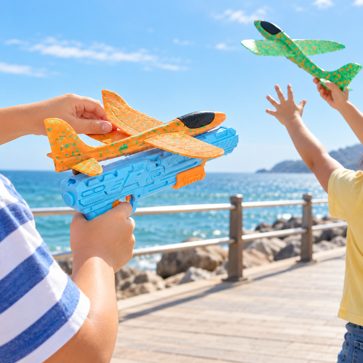 Kids enjoying foam airplane launcher play near the seaside